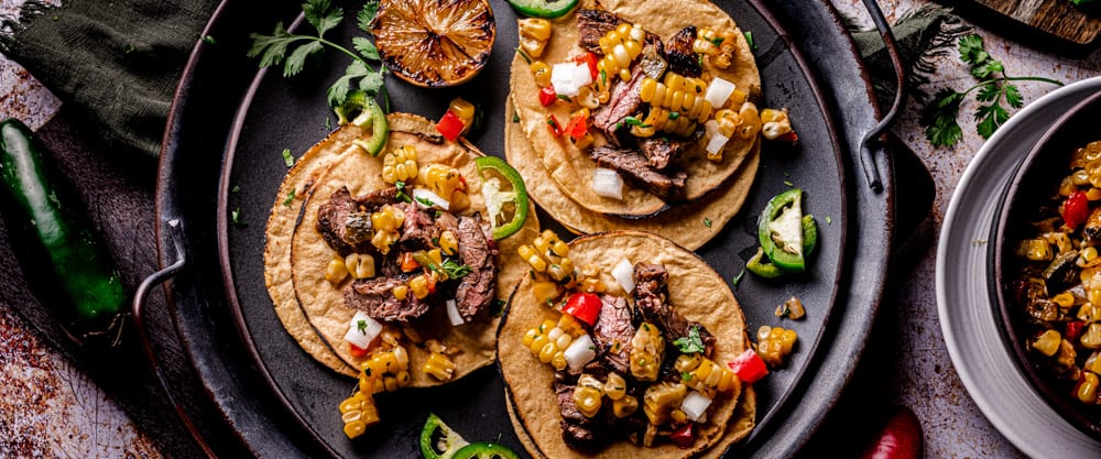 Marinated Skirt Steak Street Tacos with Spicy Corn Salad